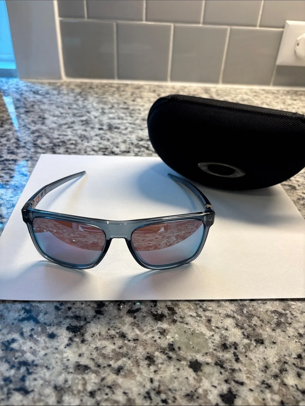 Oakley Sunglasses - Translucent Smoke Frame with Rose Mirror Lenses
